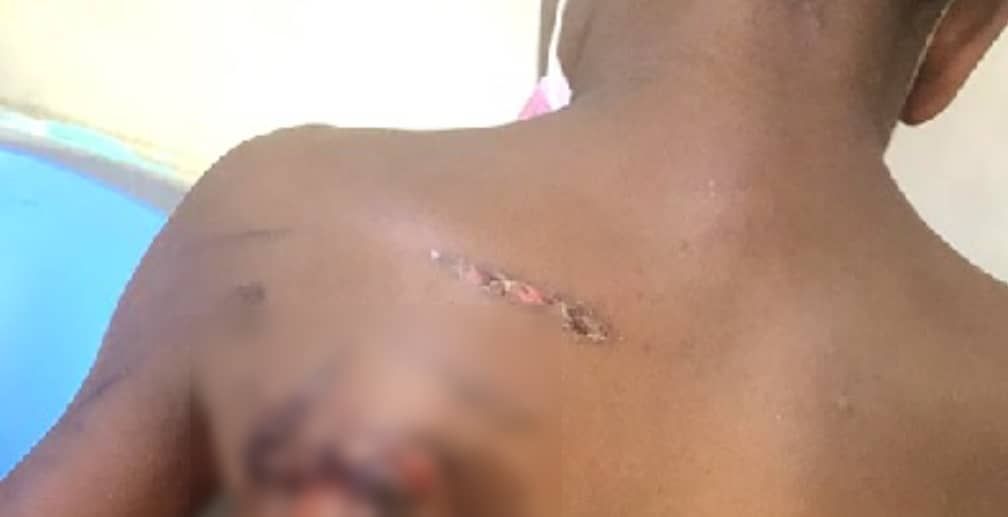 Lady punishes son with heated pressing iron